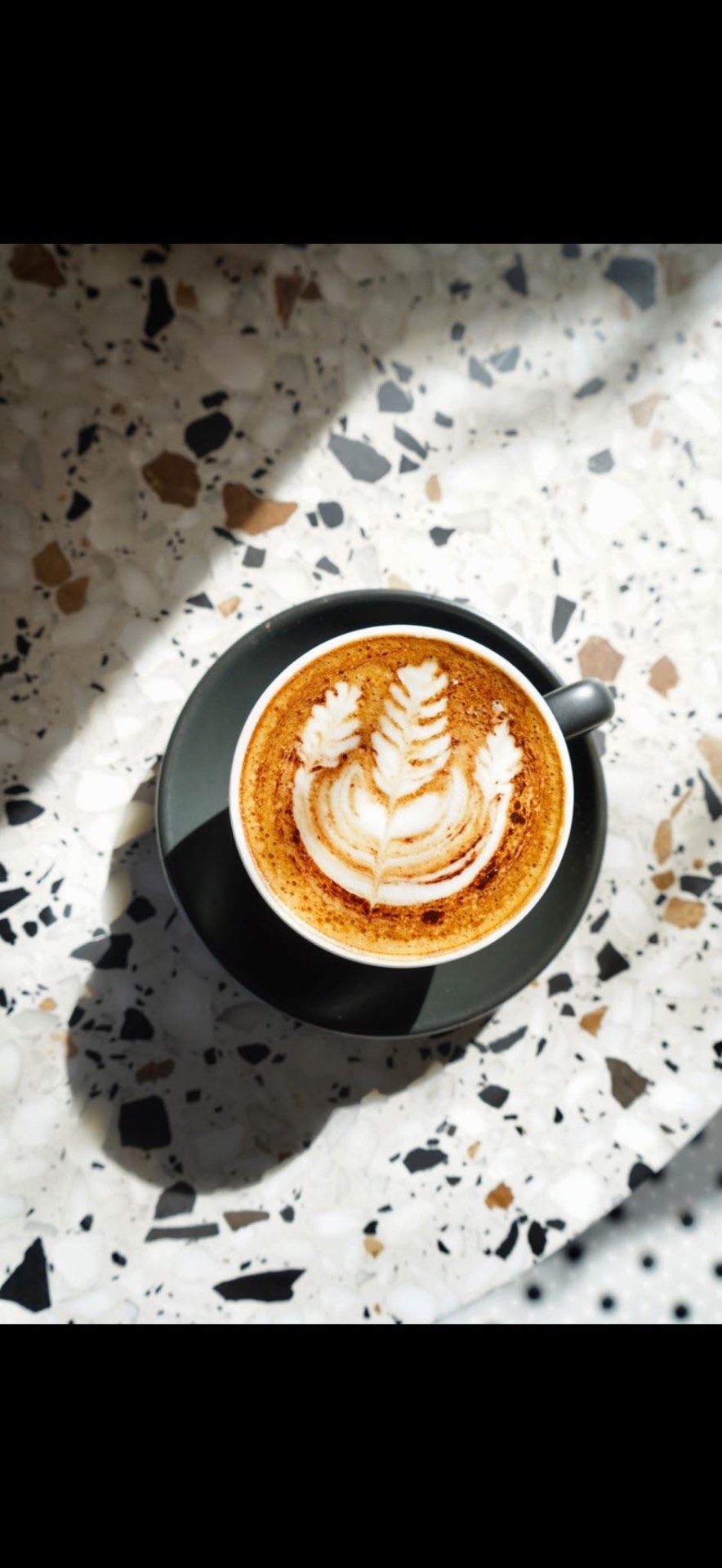 A coffee with latte art at Croccante & Co