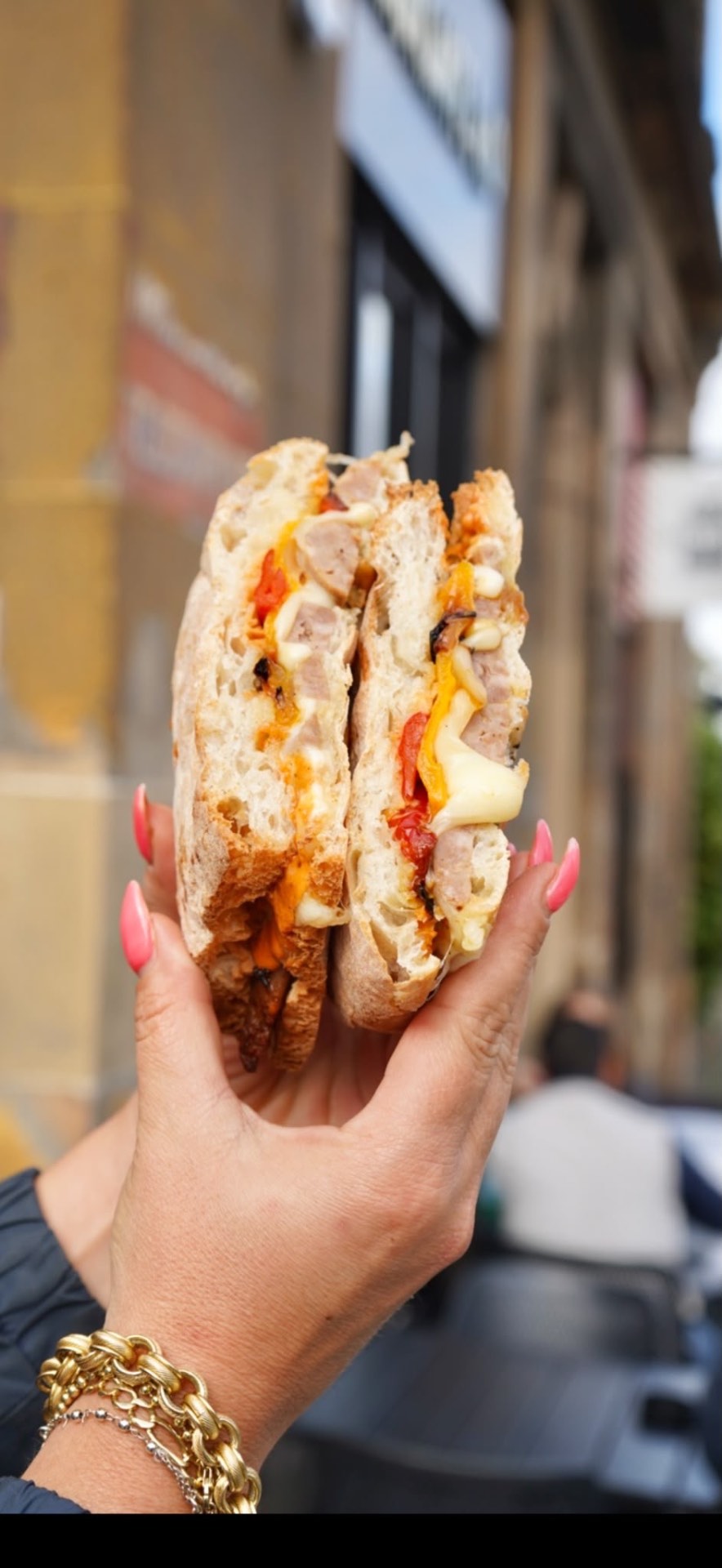 A freshly made schiacciata held outside Croccante & Co